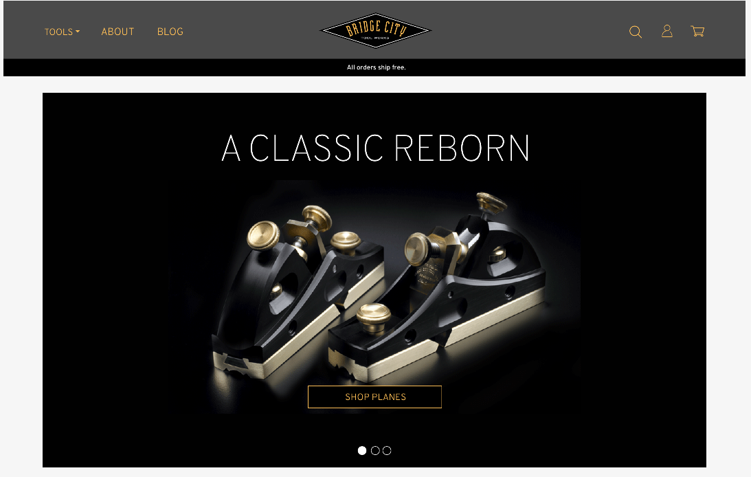 A black and gold website with a classic reborn logo.