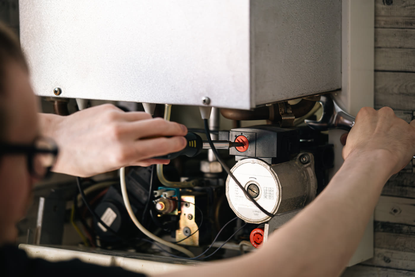 Technician servicing a furnace